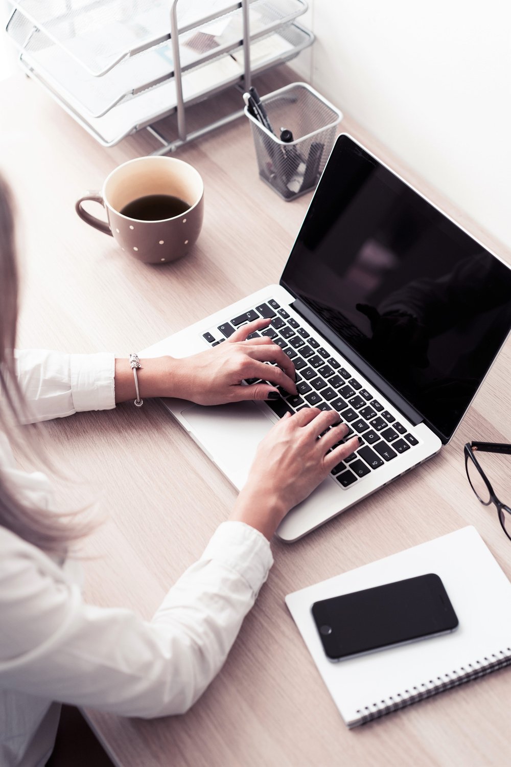 Woman Typing on Laptop